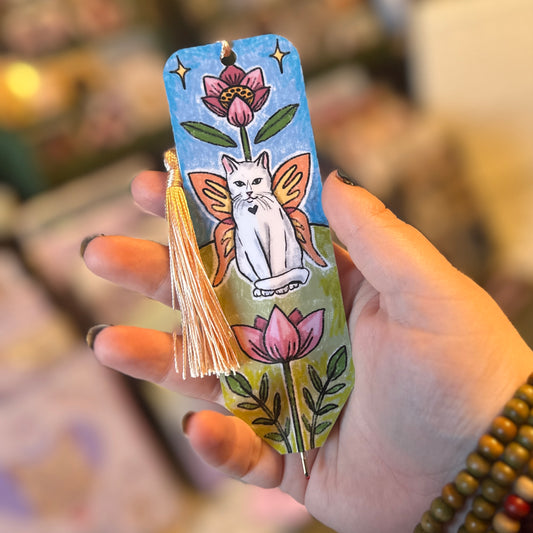white cat bookmark pen